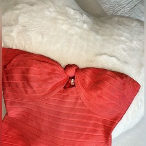 Get ready to turn heads in this stunning Herve Leger Dress.